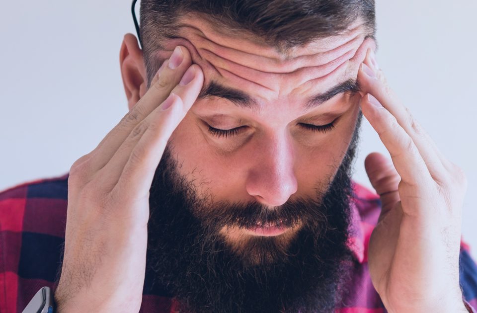 Man Experiencing a Headache